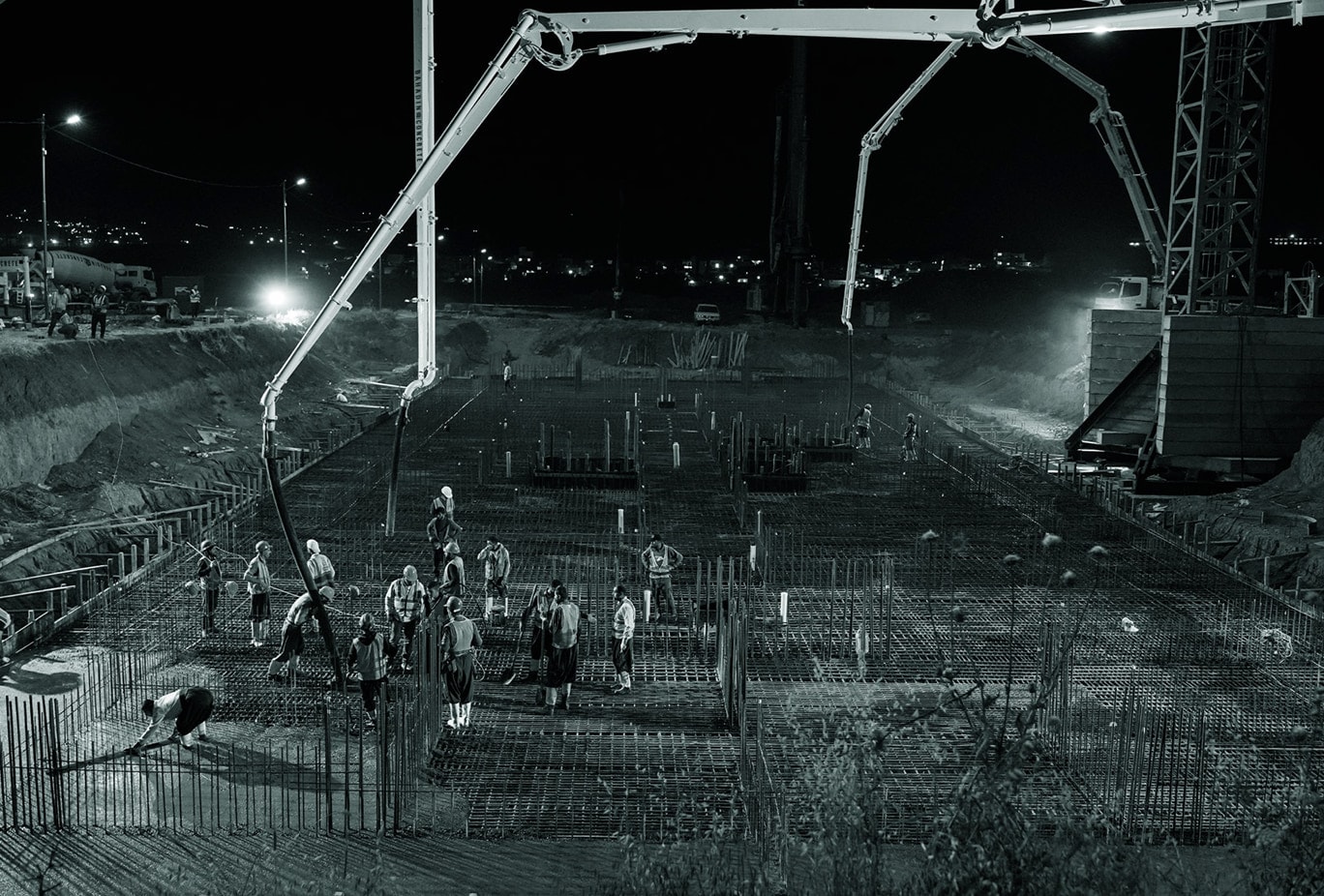 Central Park: concrete pumps pouring a foundation at night